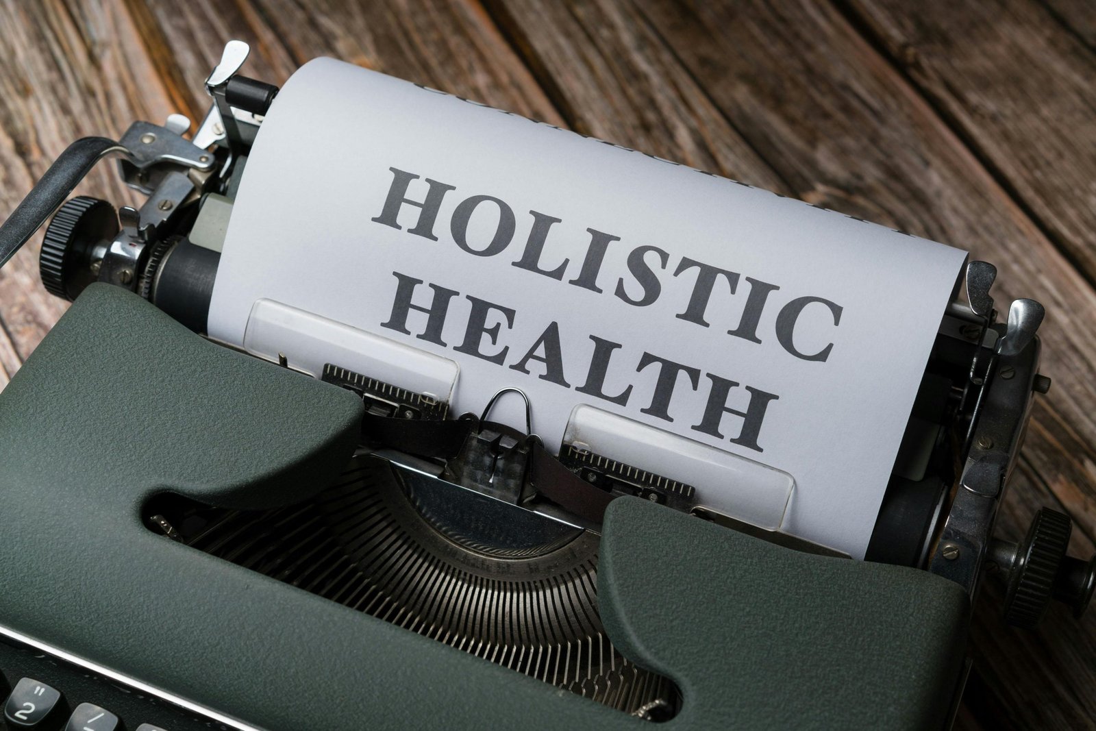A typewriter with the word holistic health on it